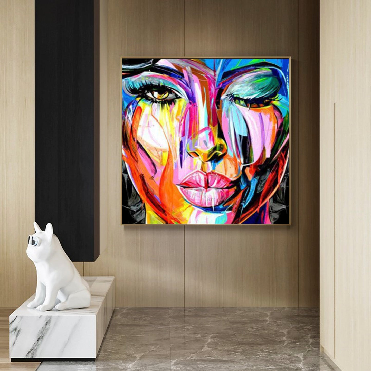 a painting of a woman's face on a wall