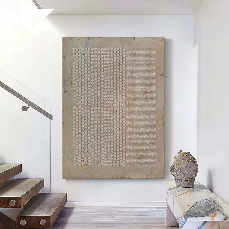 a minimalist interior design with a large abstract painting on the wall, a wooden staircase, and a marble table with a sculpture on it.