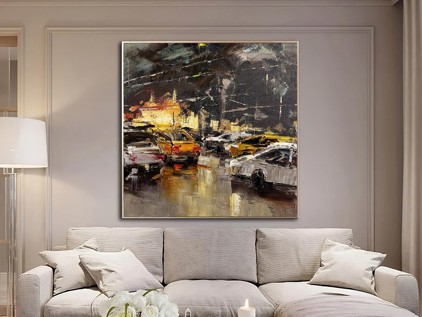 a living room with a couch and a painting on the wall