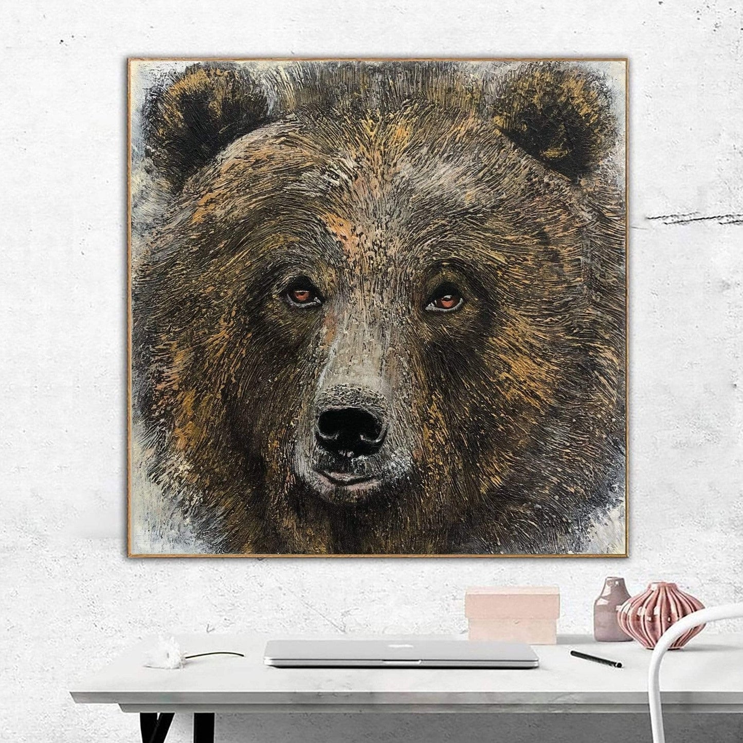 a painting of a brown bear on a white wall