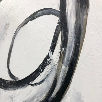 The image is an abstract painting with bold black and white brushstrokes, creating a sense of movement and energy.