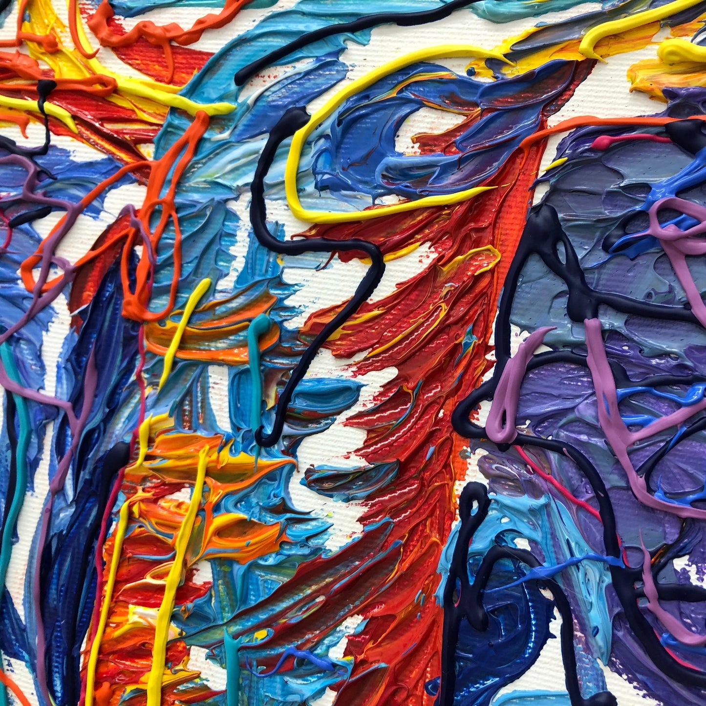 The image is a vibrant and colorful abstract painting, featuring a variety of bold brushstrokes and splatters of paint in a range of bright colors including red, blue, yellow, and purple. The painting appears to be a dynamic and expressive piece of art, with the artist's use of color and texture creating a visually striking and captivating composition.