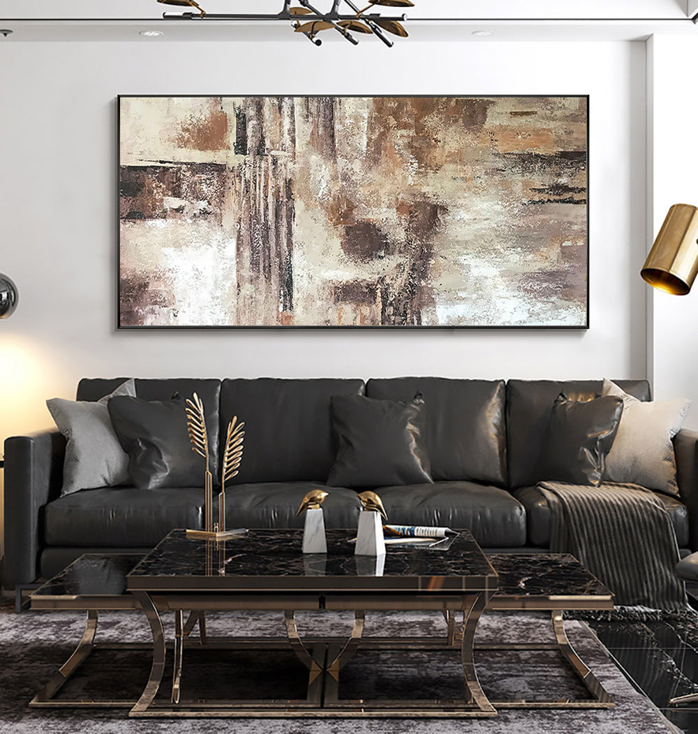 a living room with a large painting on the wall
