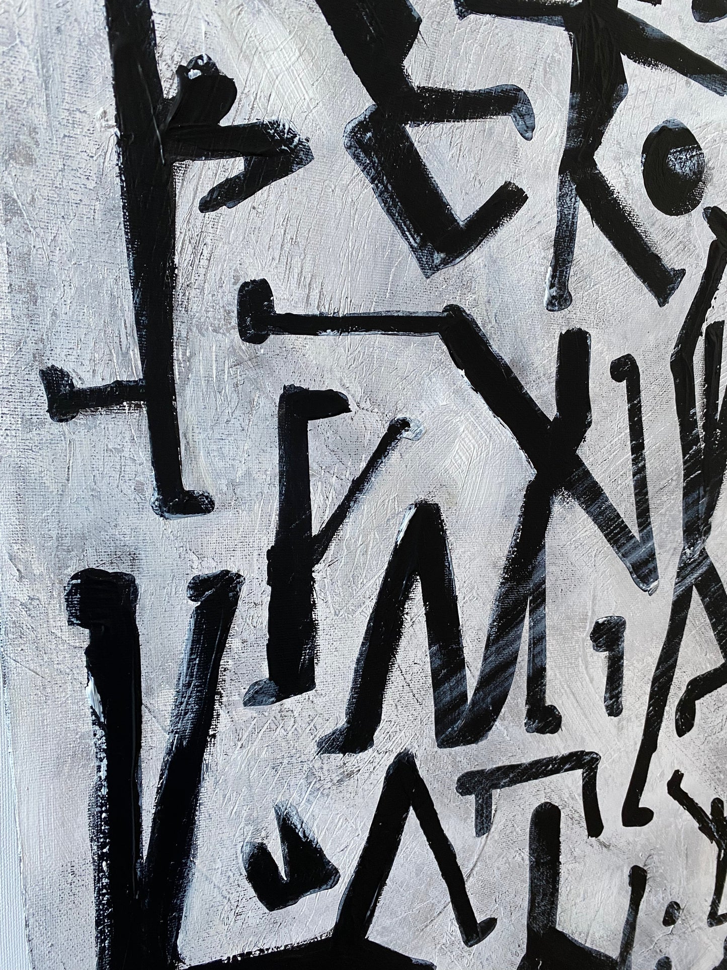 a painting of black and white letters and numbers