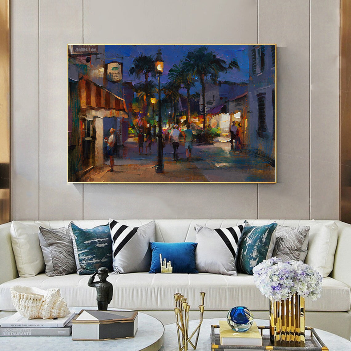 a living room filled with furniture and a painting on the wall