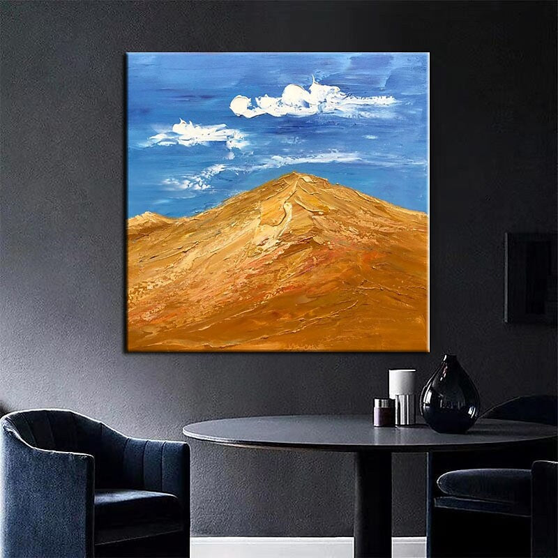 a painting of a mountain with clouds in the sky