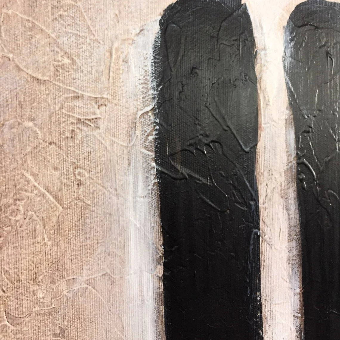 The image is a close-up of a textured surface with a black and white striped pattern.