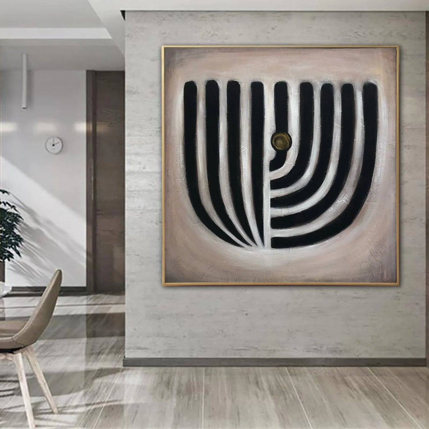 a modern art piece with a bold, abstract design on a wall.