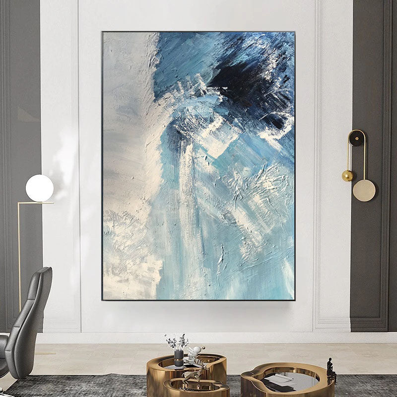 a living room with a large painting on the wall