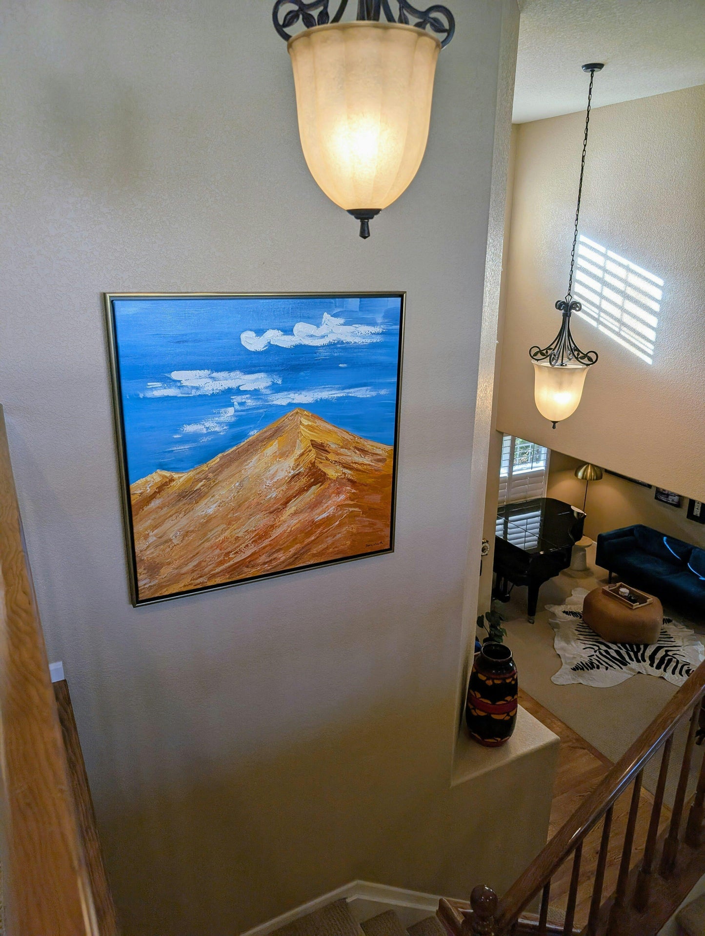 a painting hanging on the wall of a house