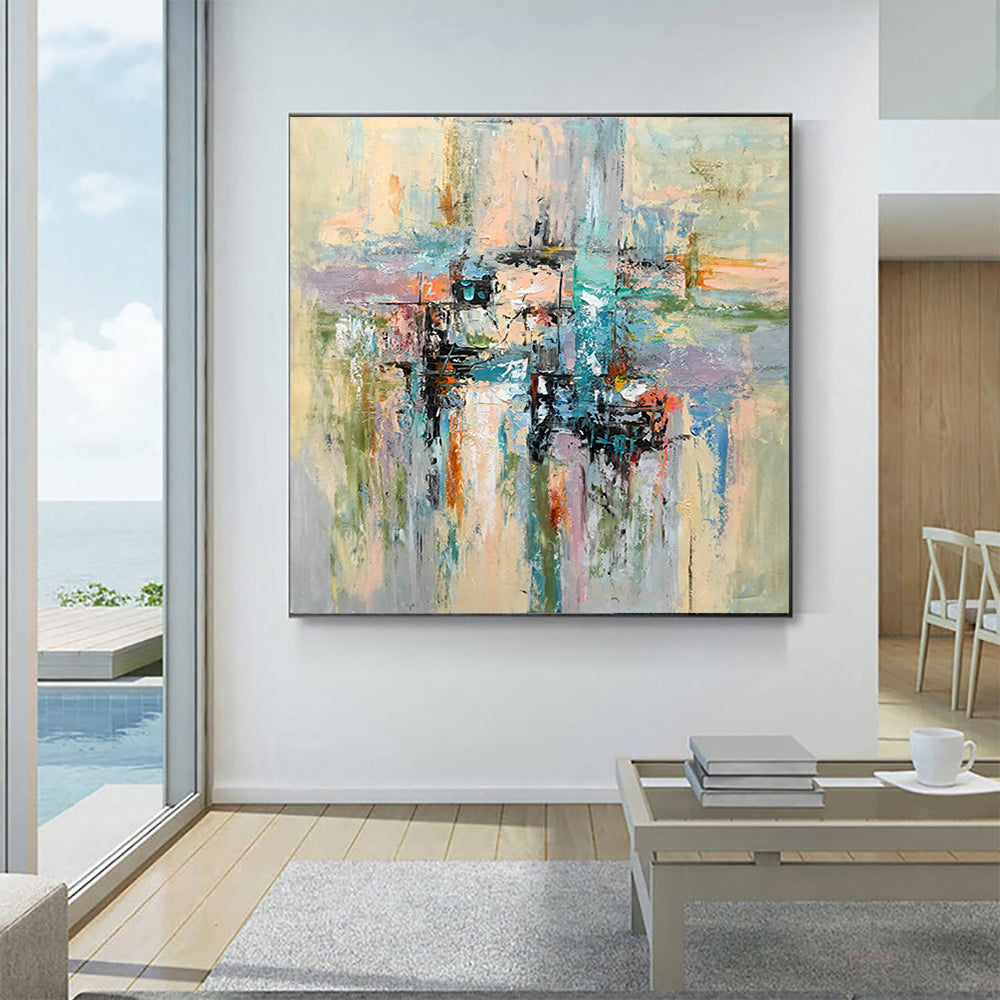 a living room with a large painting on the wall