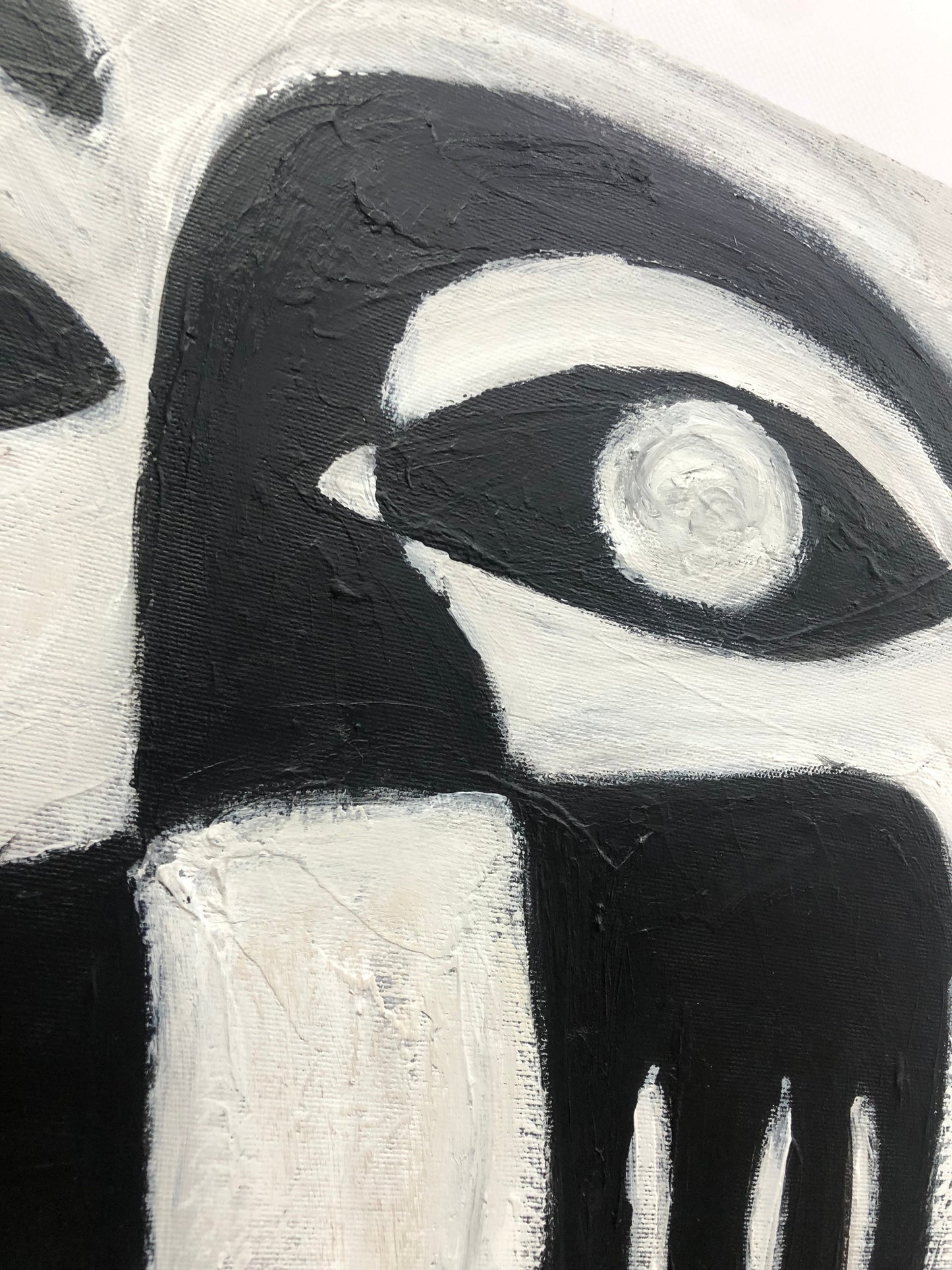a black and white painting of a woman's face