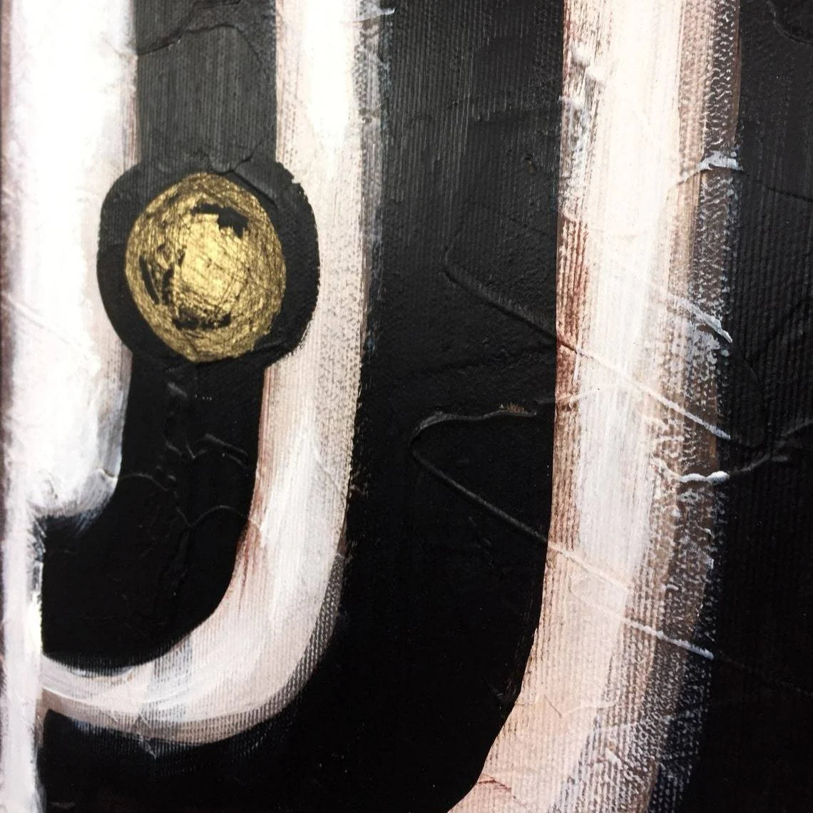 The image is an abstract painting with bold black and white lines and a large gold circle in the center.
