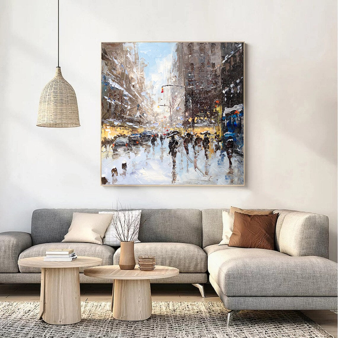 a living room with a couch and a painting on the wall