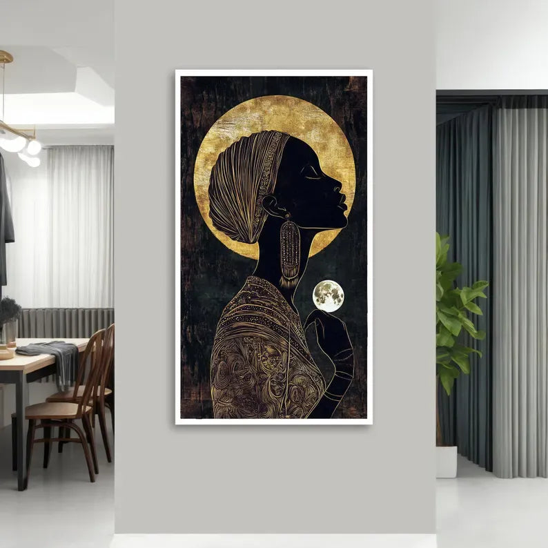 a large framed artwork depicting a woman with a headdress and a moon in her hand, set against a dark background with a golden circle above her head.