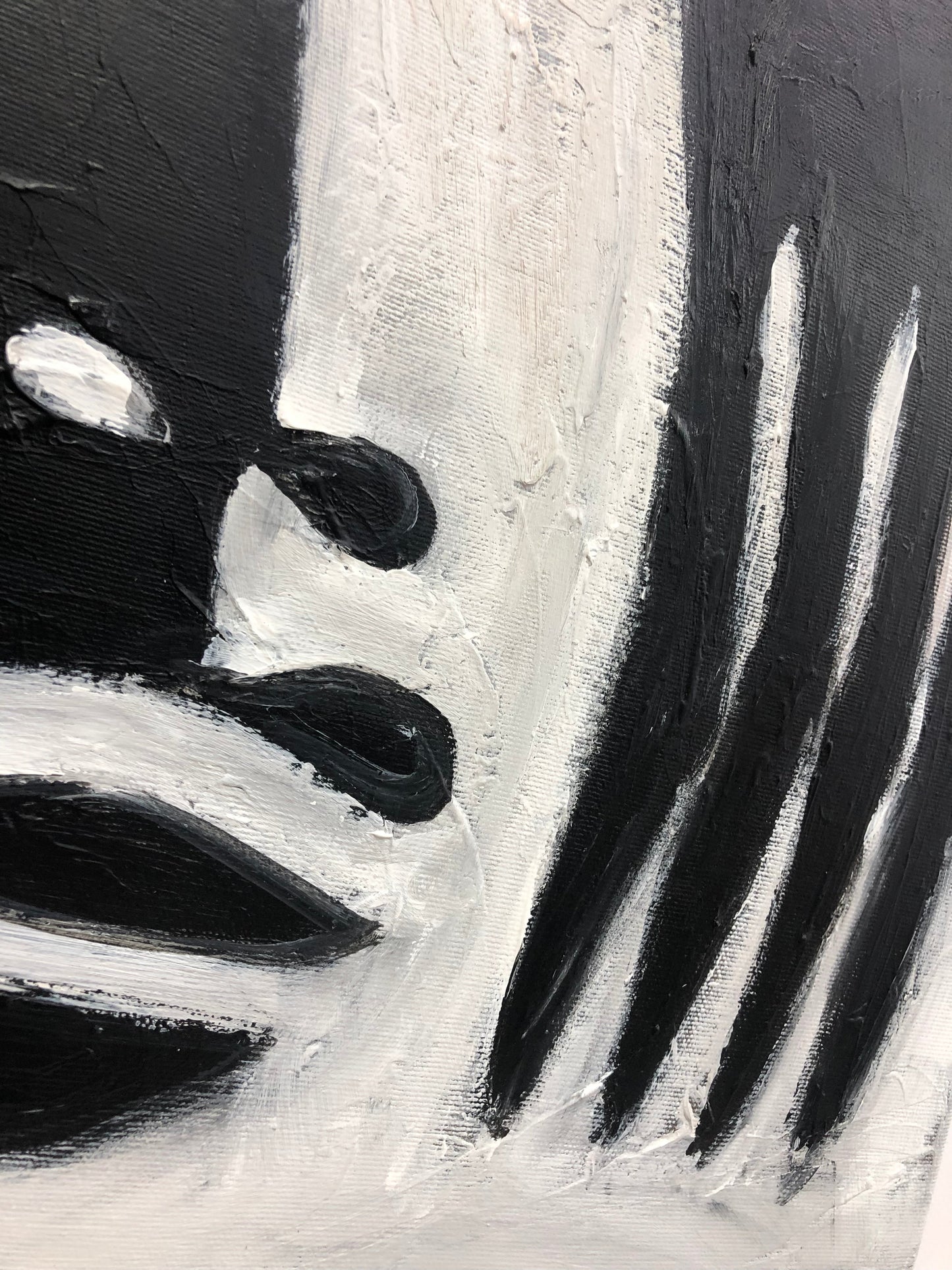 a black and white painting of a man's face