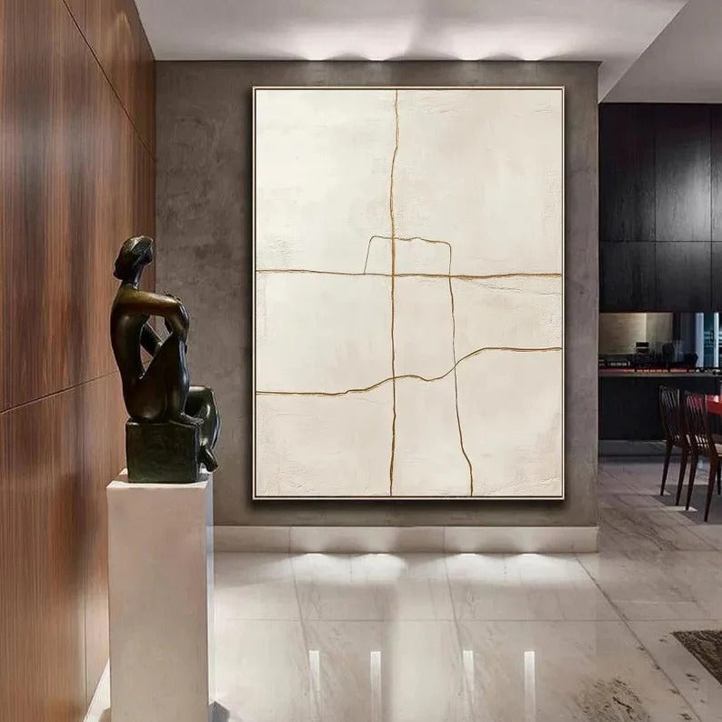 a modern art gallery with a large abstract painting on the wall, a bronze sculpture on a pedestal, and a dining table in the background.