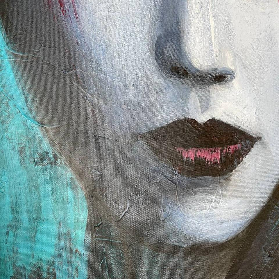The image is a close-up of a woman's face, with a focus on her lips and the surrounding texture.