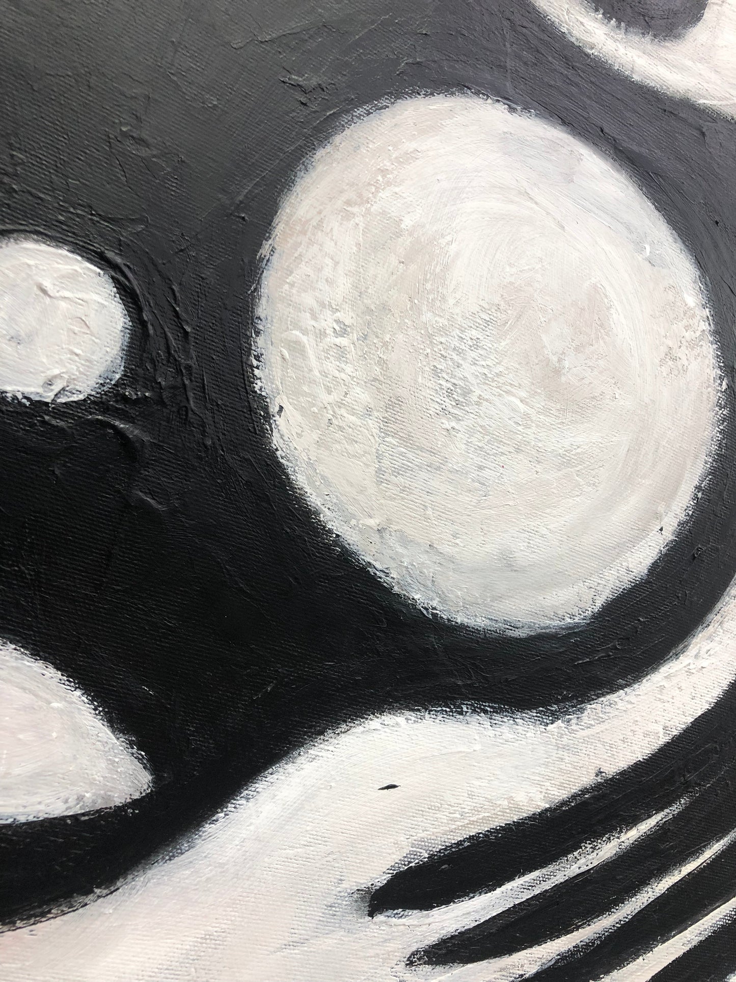 a black and white painting with circles on it