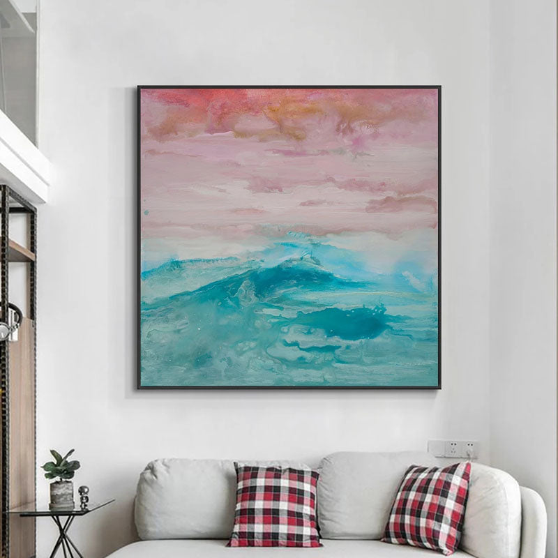 a living room with a couch and a painting on the wall