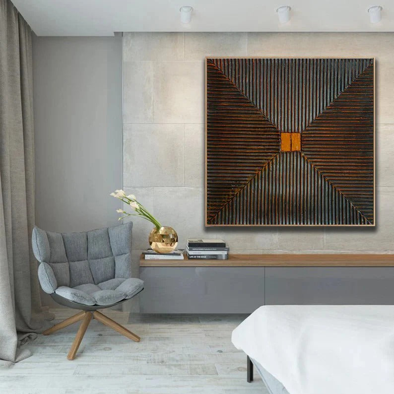 a modern bedroom with a gray chair, a large abstract painting on the wall, and a wooden bookshelf with books.