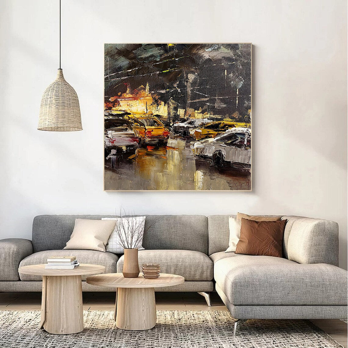 a living room with a large painting on the wall