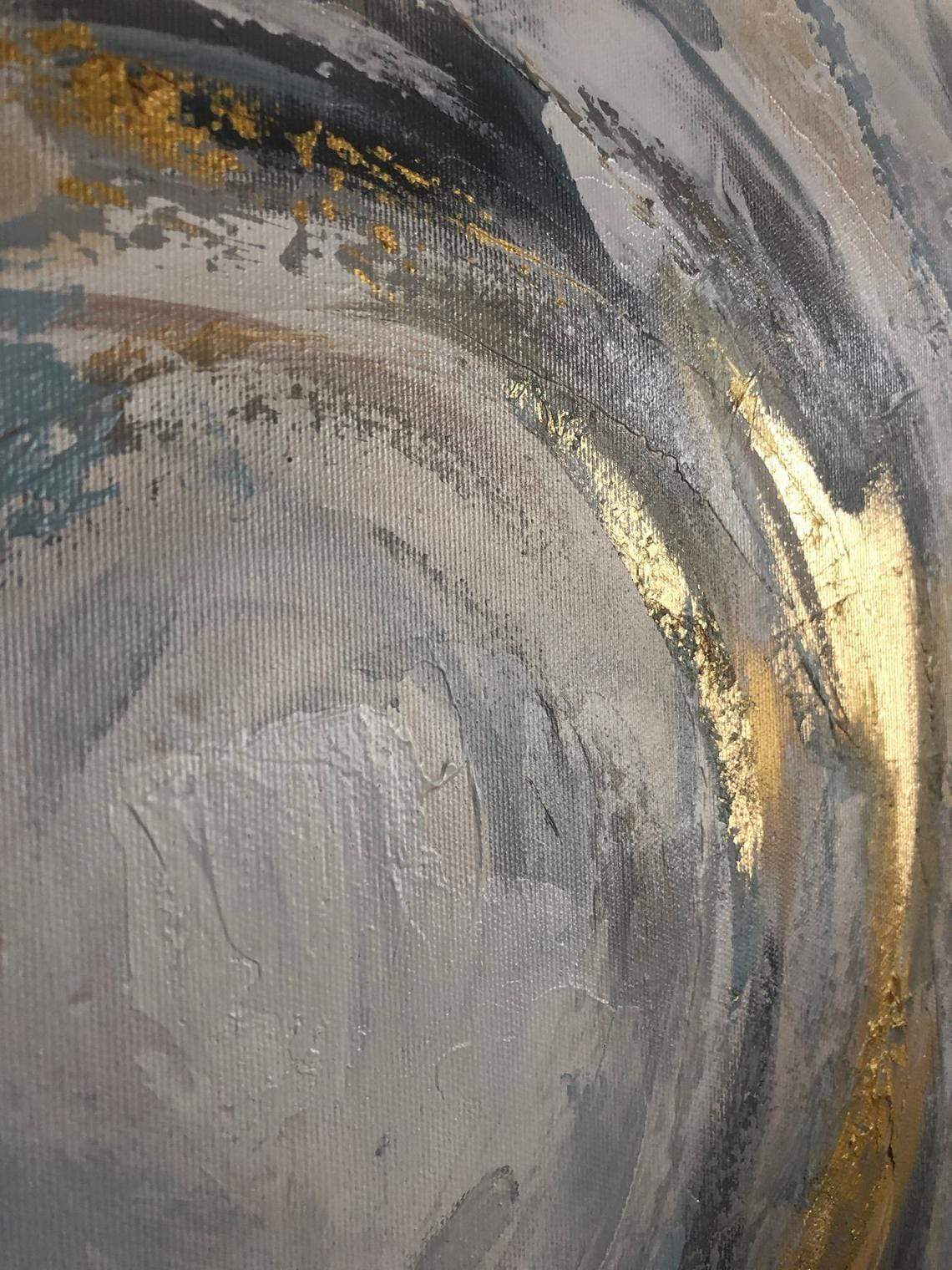a close up of a painting with gold paint