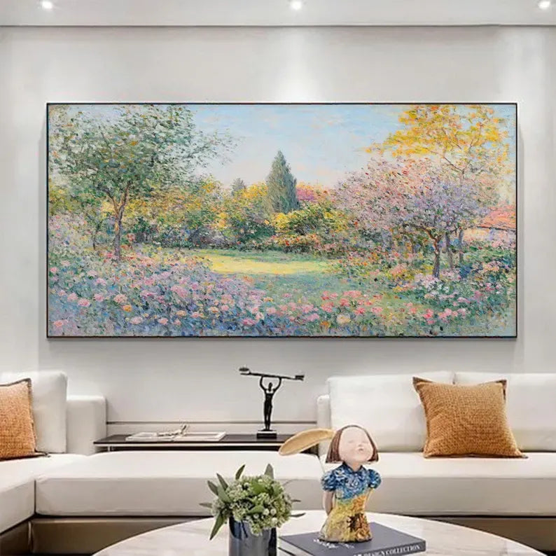 a large, colorful painting of a garden scene hanging on a wall above a white couch in a living room.