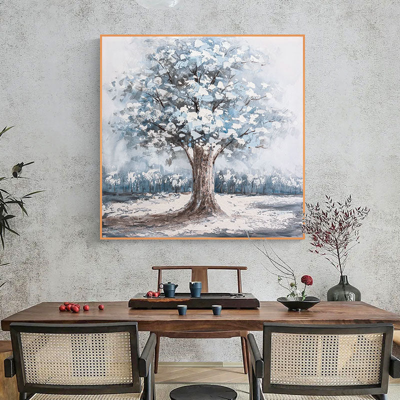 a painting of a tree in a dining room
