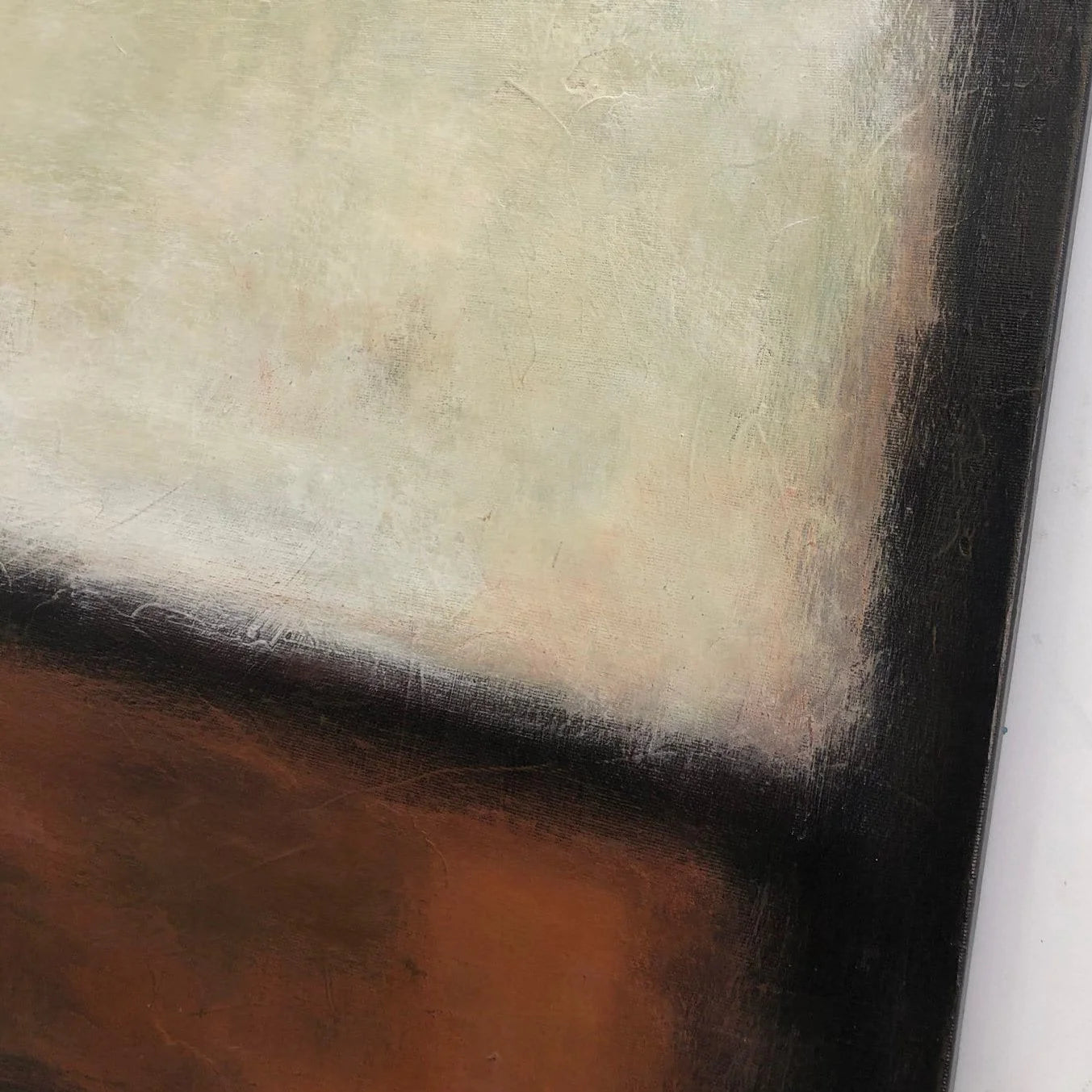 The image is a close-up of a painting with a predominantly white background and a dark brown area on the right side.
