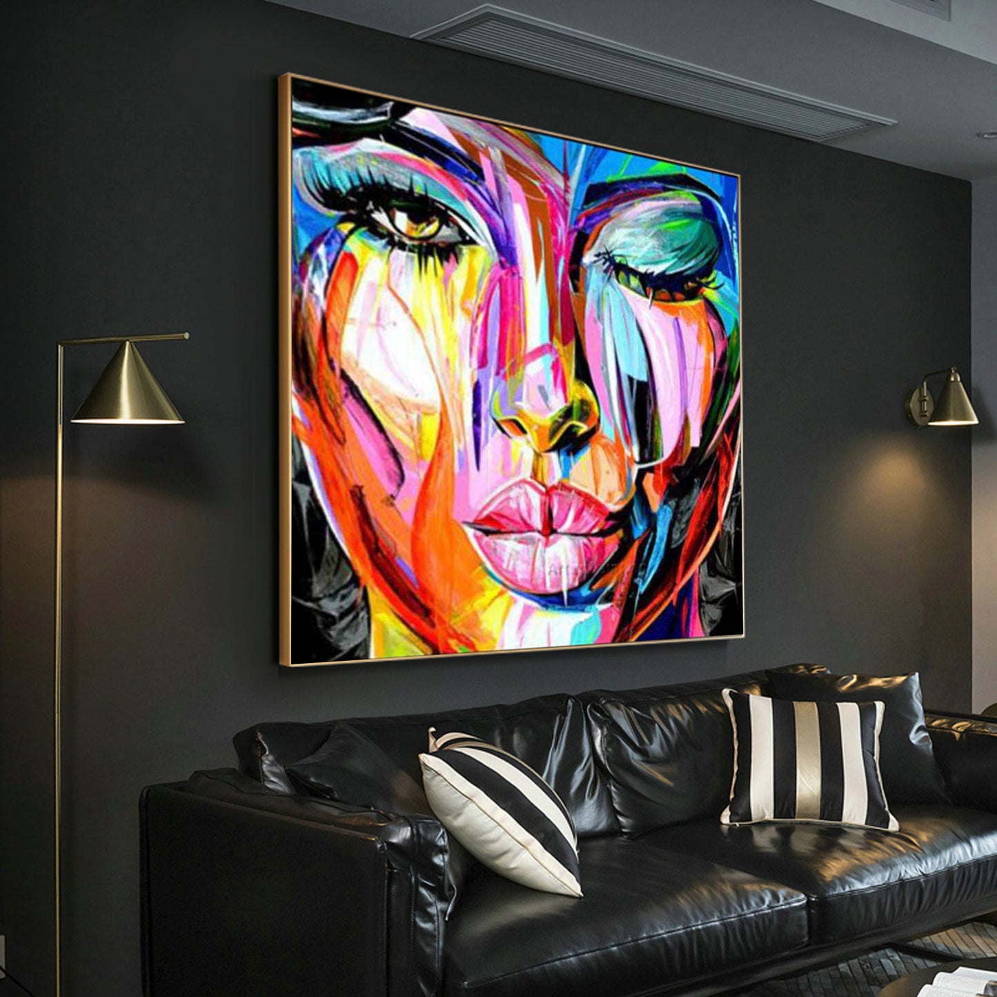 a living room with a couch and a painting on the wall