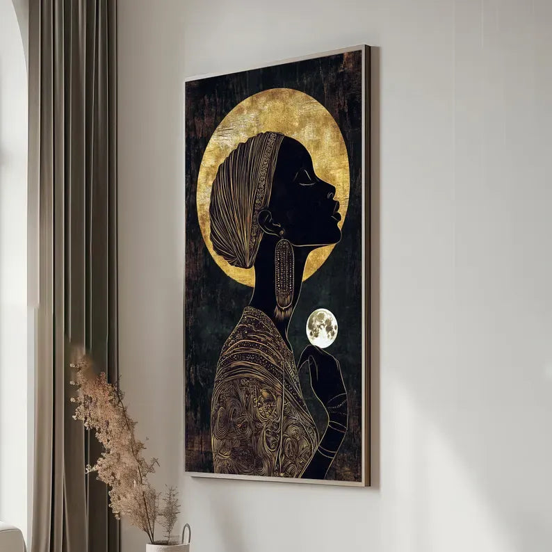 a framed artwork depicting a woman with a large golden moon behind her.