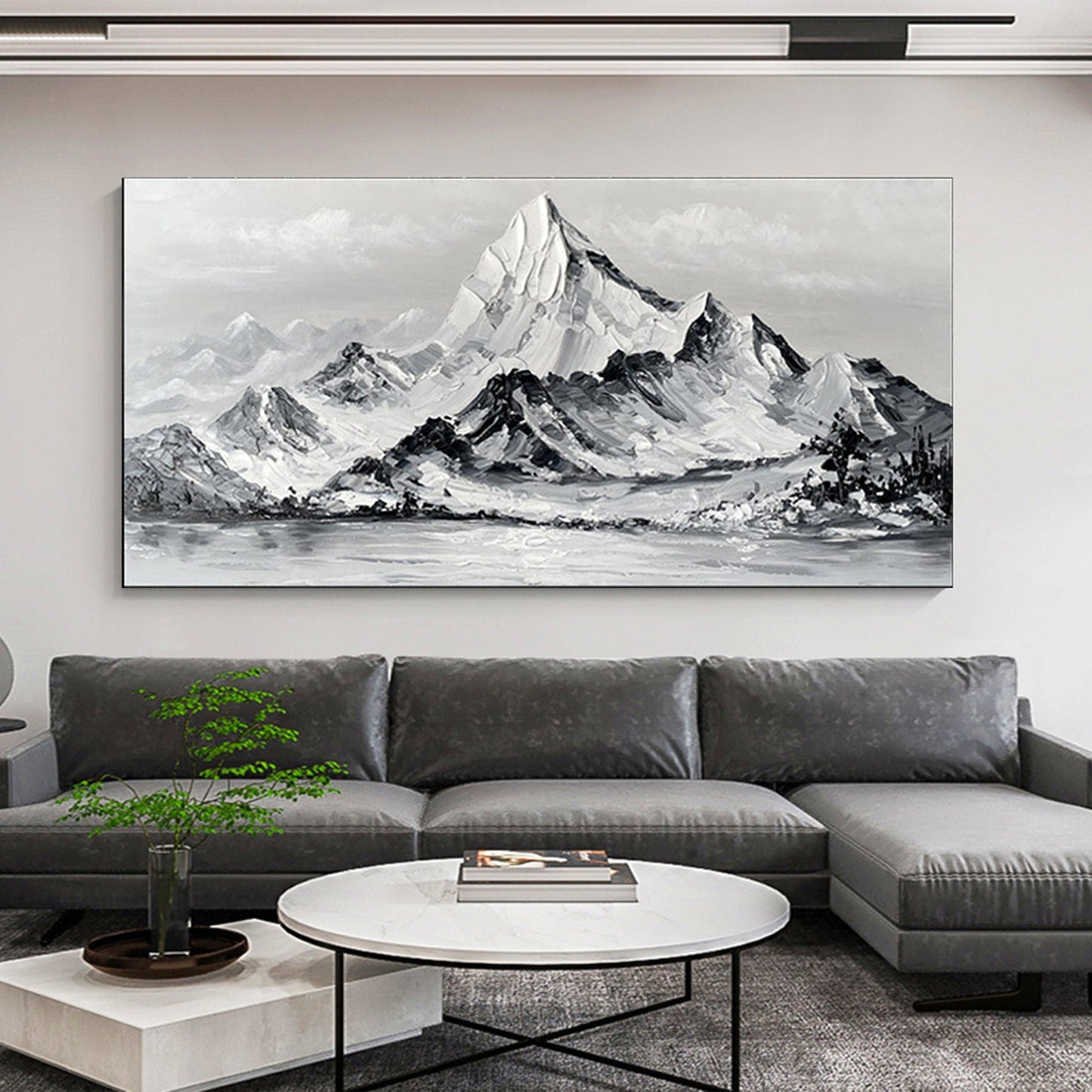 a living room with a large painting on the wall