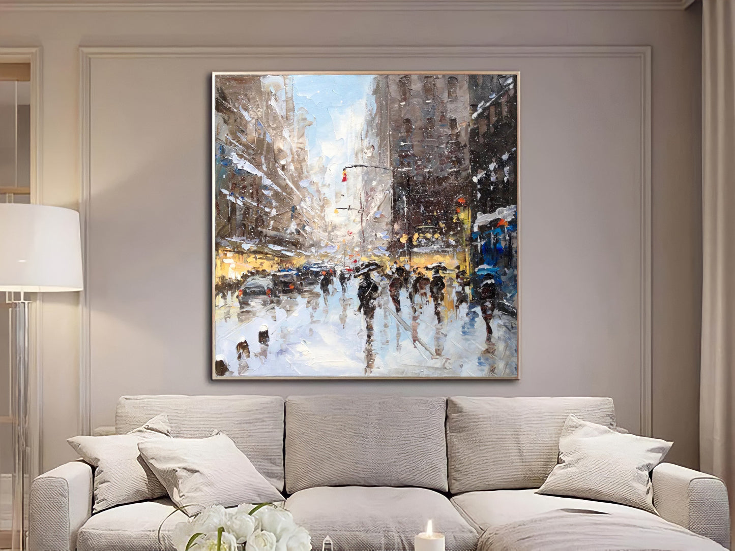 a living room with a couch and a painting on the wall