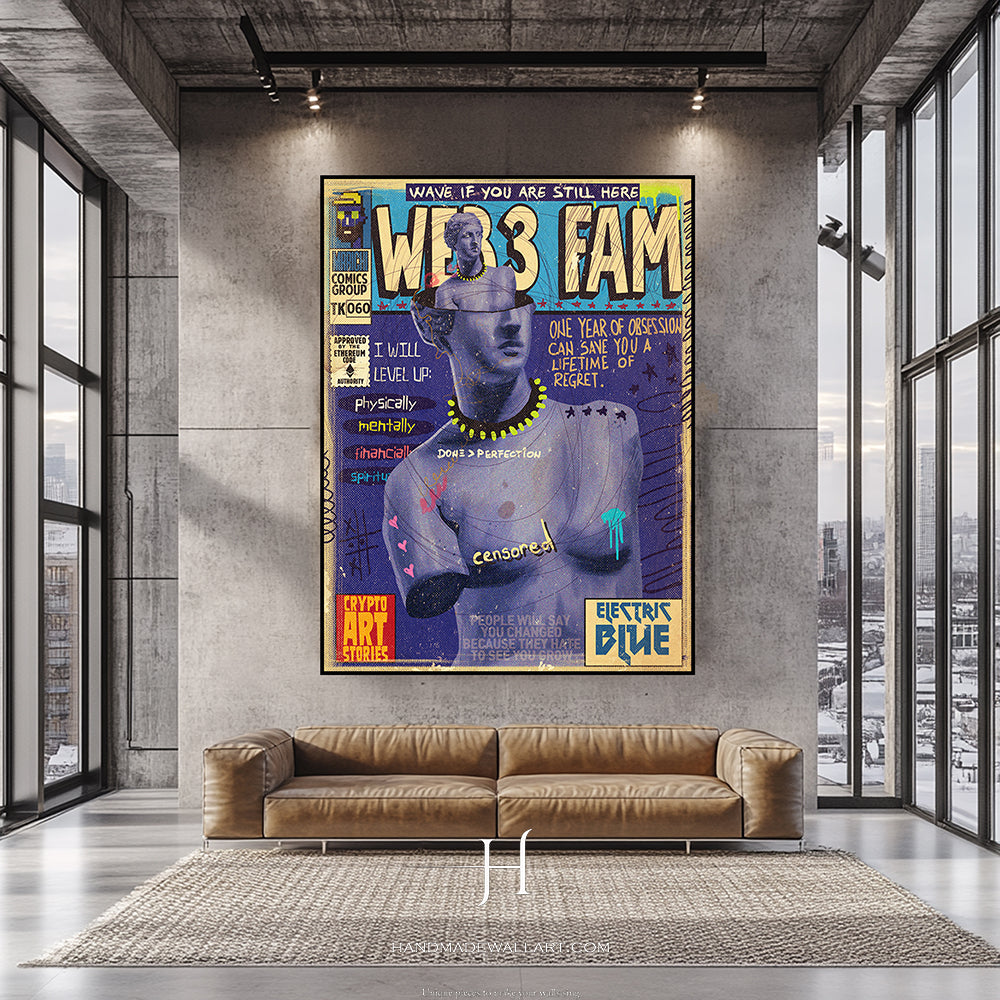 a living room with a couch and a poster on the wall