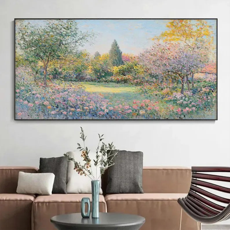 a large painting of a colorful garden scene hanging on a wall above a couch with decorative pillows.