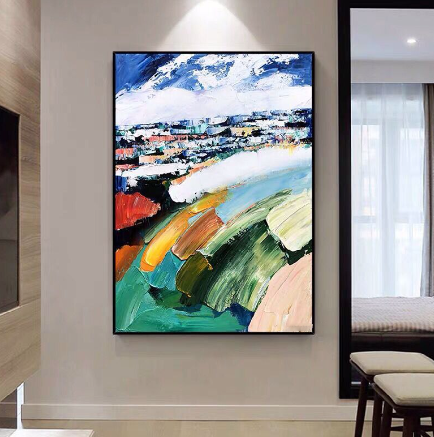 a painting hanging on a wall in a room