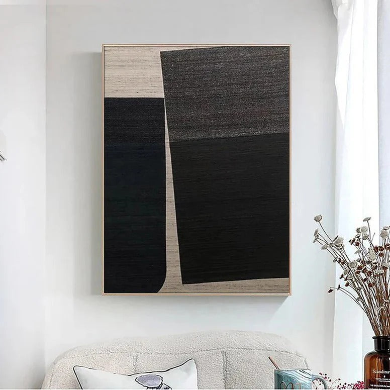 a large abstract painting hanging on a white wall above a couch.