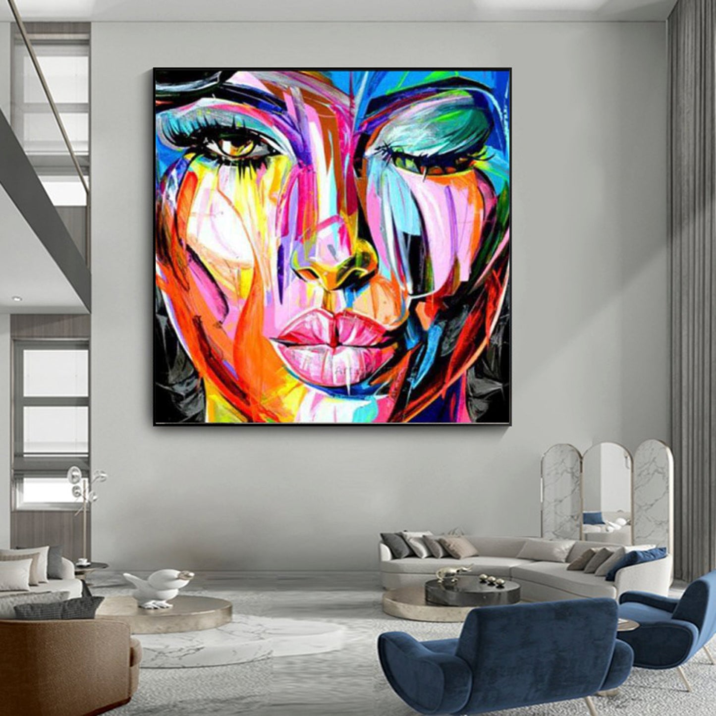 a painting of a woman's face on a wall