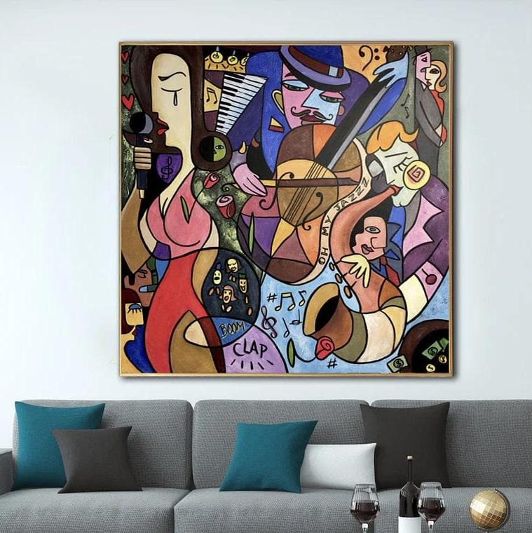 The image is a vibrant and colorful abstract painting hanging on a wall above a gray couch. The painting features a variety of shapes, colors, and musical instruments, creating a lively and dynamic composition.