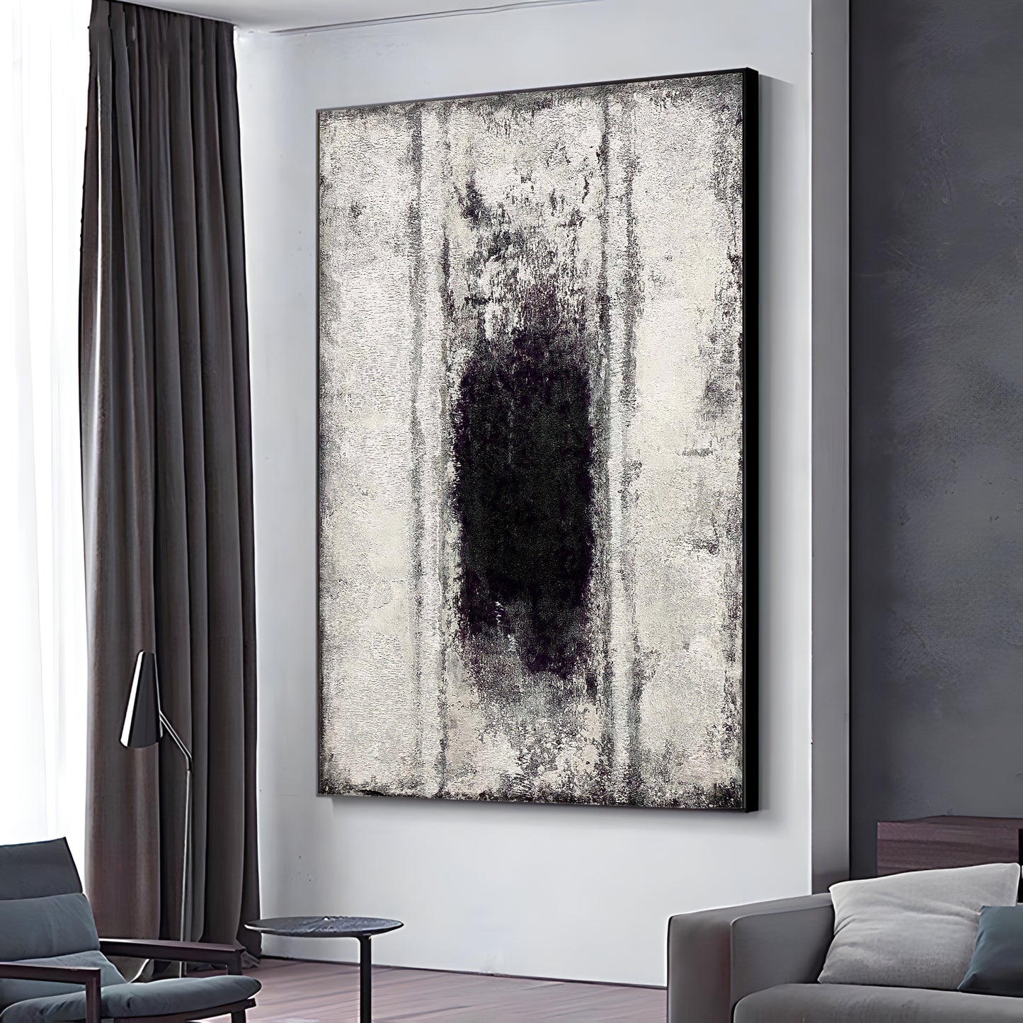 a living room with a couch and a painting on the wall