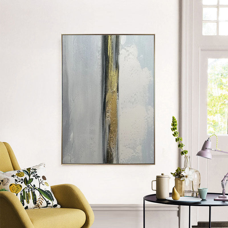 a living room with a yellow chair and a painting on the wall