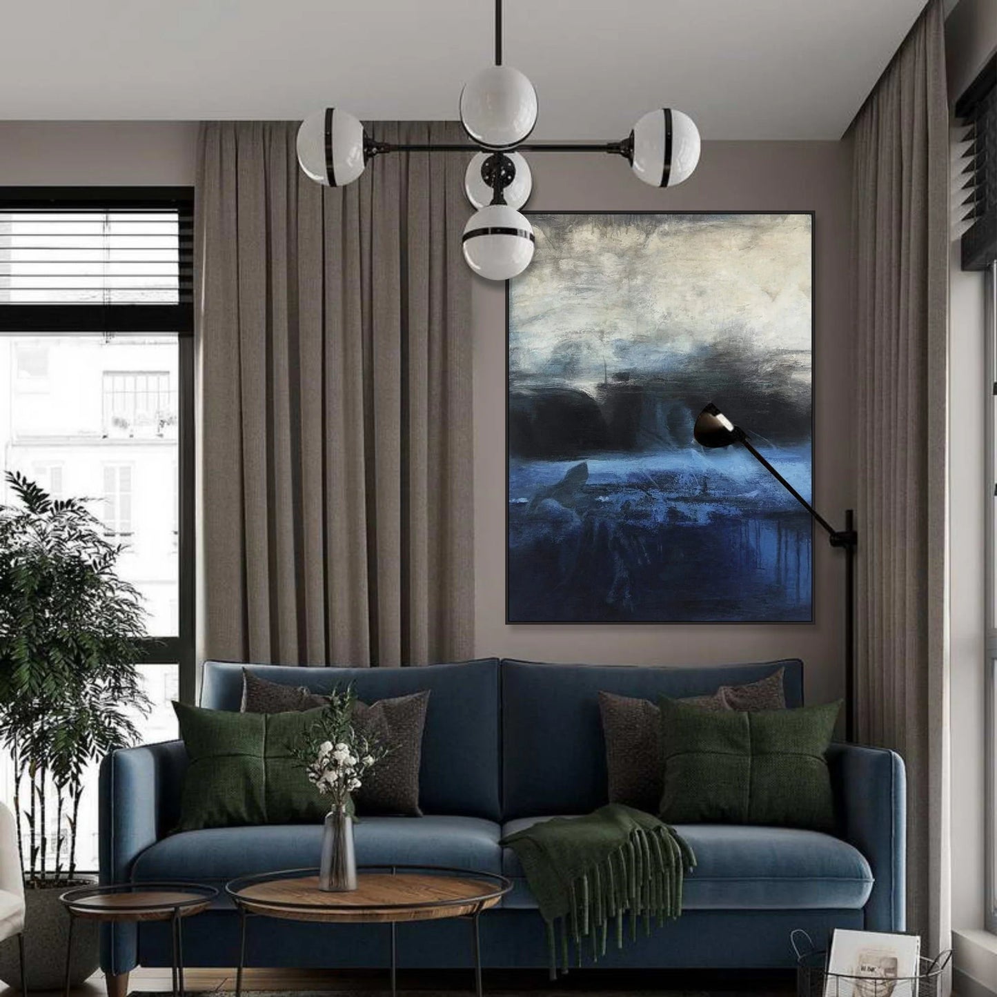 a modern living room with a blue sofa, a wooden coffee table, and a large painting of a cityscape hanging on the wall.