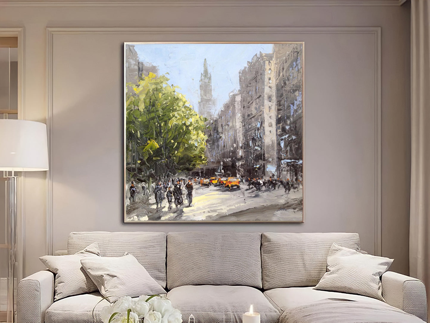 a living room with a couch and a painting on the wall