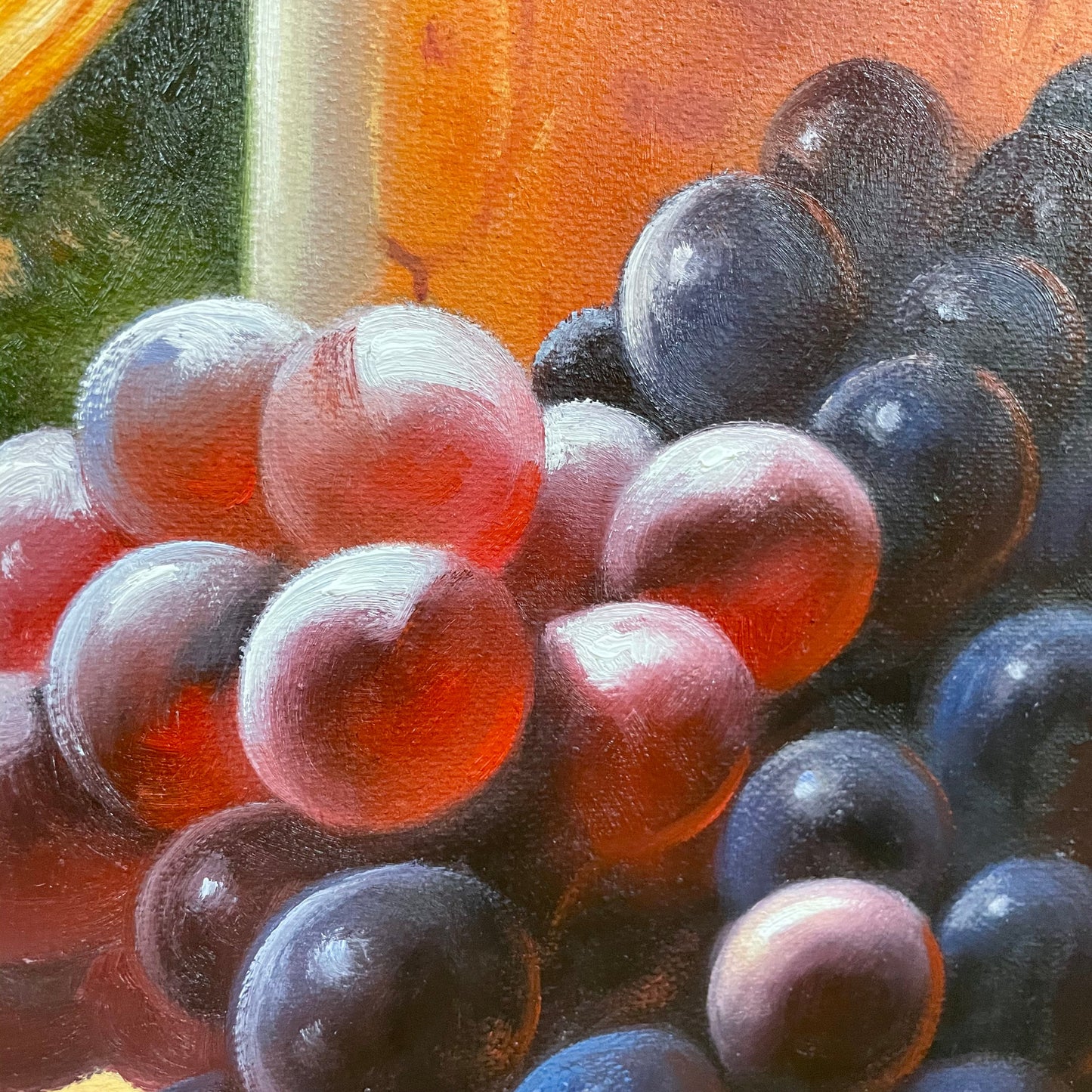 a painting of a bunch of grapes on a table