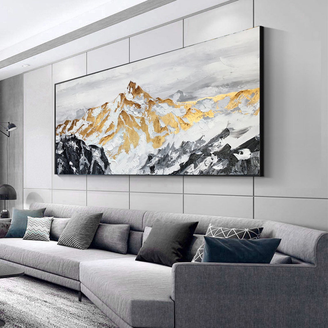 a living room with a large painting on the wall