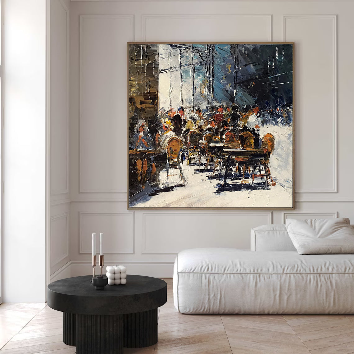 a living room with a couch and a painting on the wall