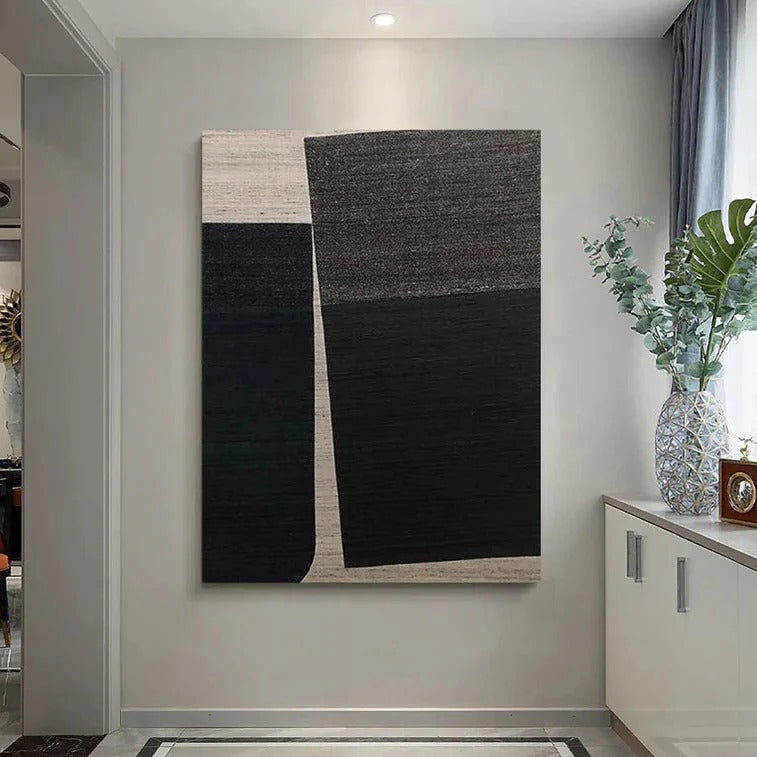 a large abstract painting hanging on a wall in a hallway.