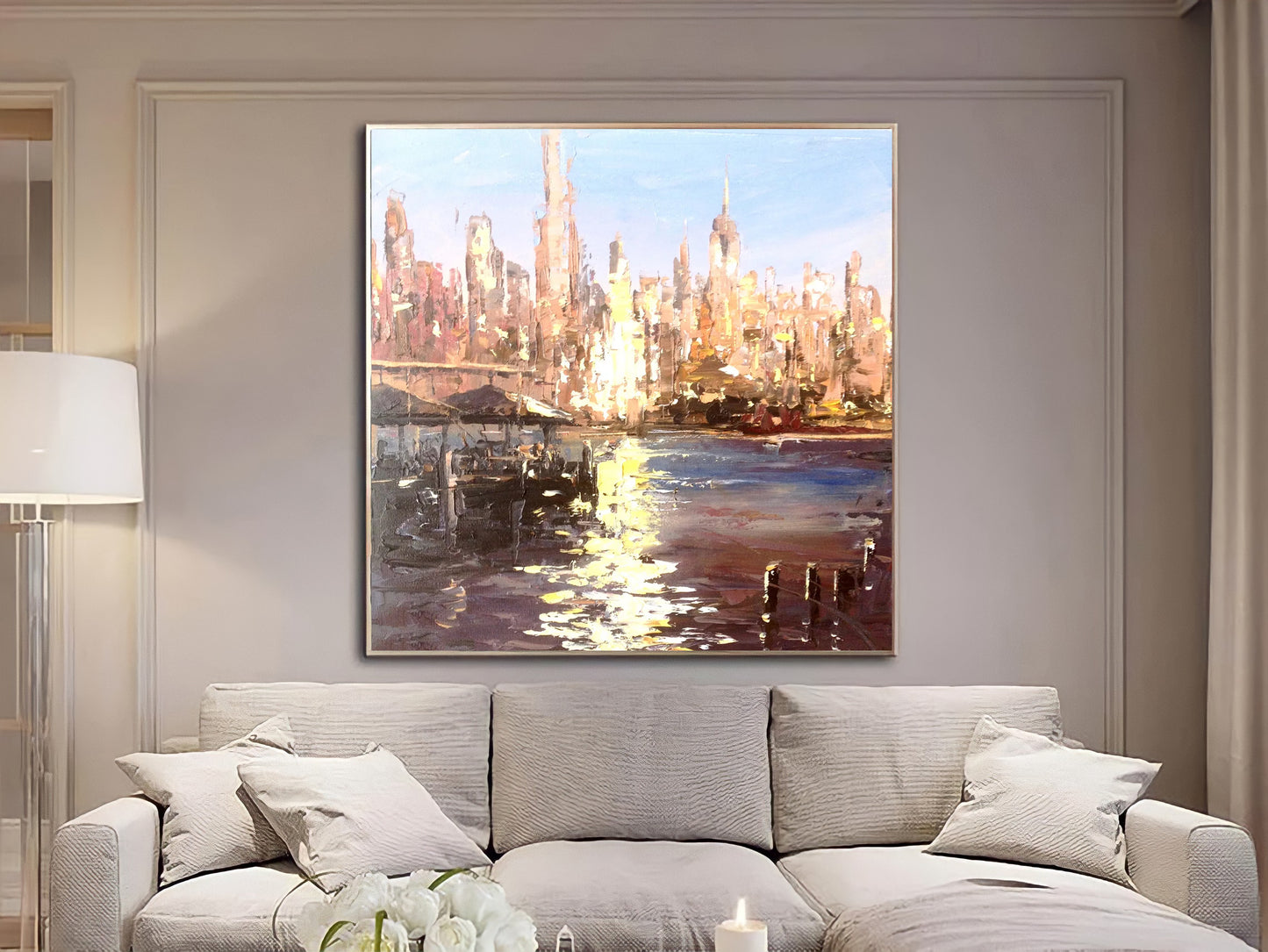 a living room with a couch and a painting on the wall