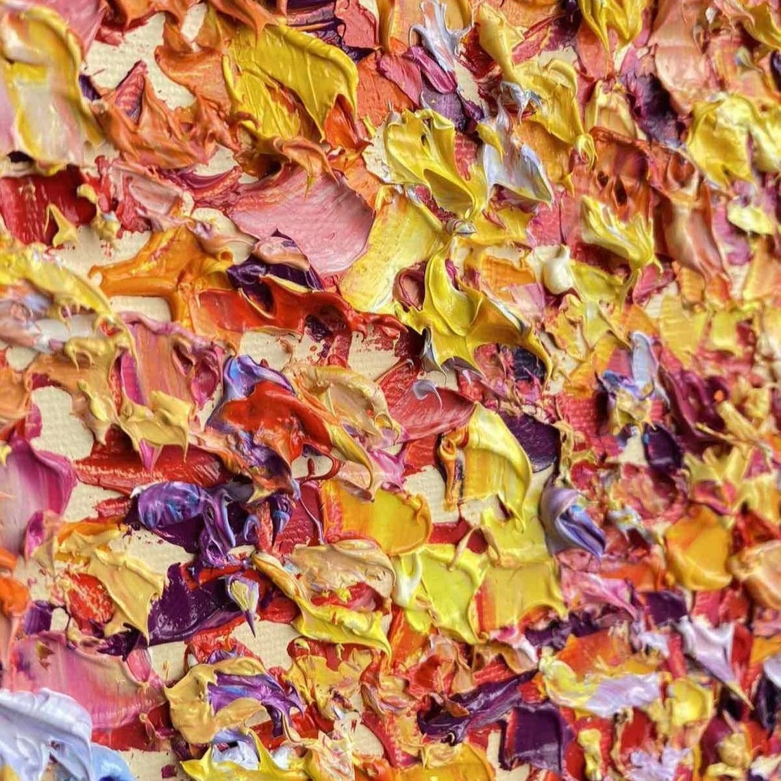 The image is a vibrant and colorful abstract painting, featuring a variety of bold and bright colors such as yellow, orange, pink, and purple. The painting appears to be a dynamic and energetic composition, with the use of these vivid hues creating a visually striking and captivating effect.